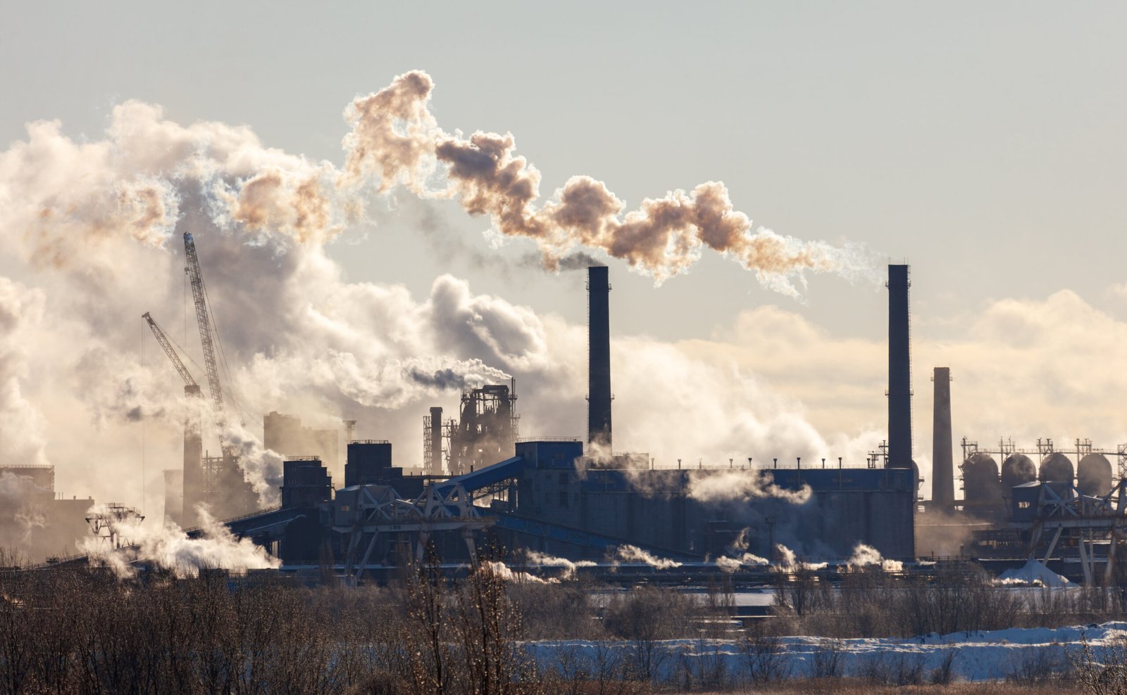 A factory is spewing smoke into the sky